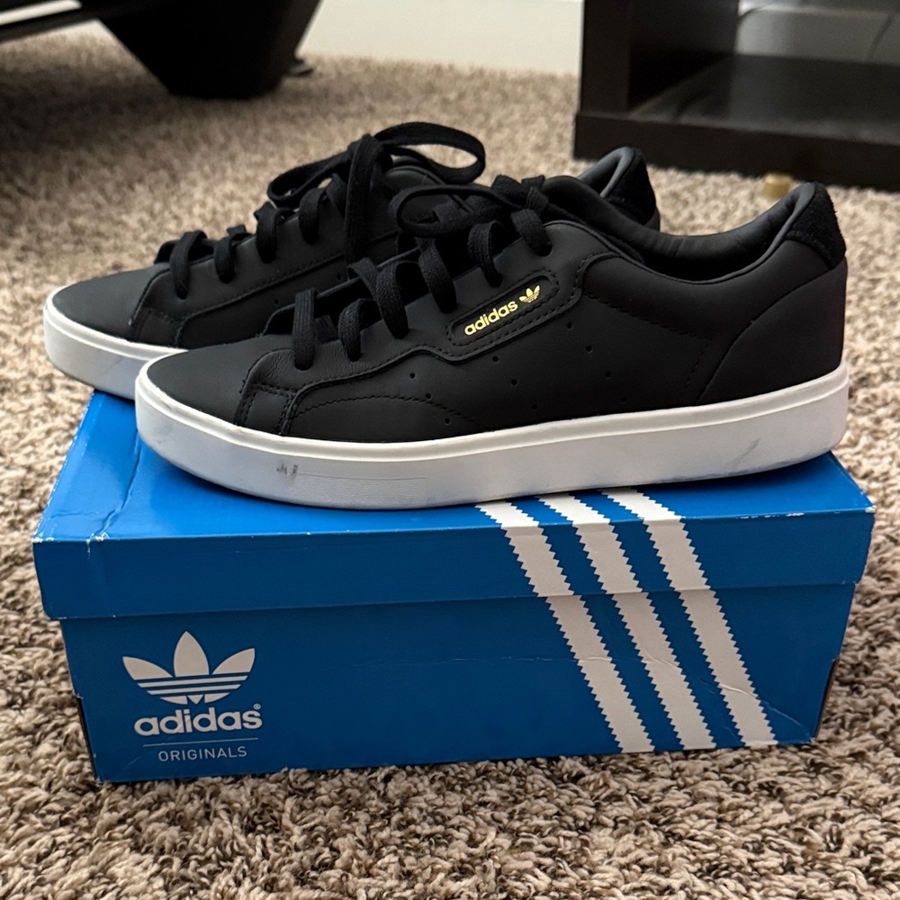 Adidas Black and White Sneakers with Gold Accents